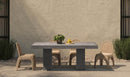 Antonius Dark Grey Outdoor Dining Table in a patio setting