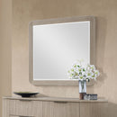 Byron Dupe light oak mirror on a white background