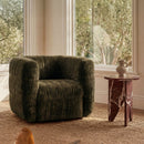 Robson Swivel Chair in Dark Green styled in an interior